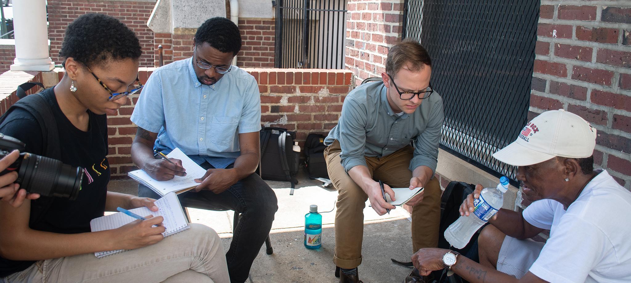 Howard Center students conducting interviews in Baltimore.