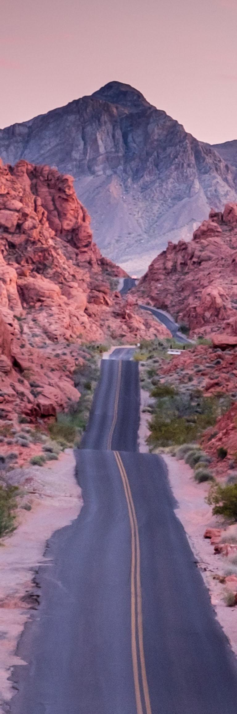 Desert highway leading to a mountain