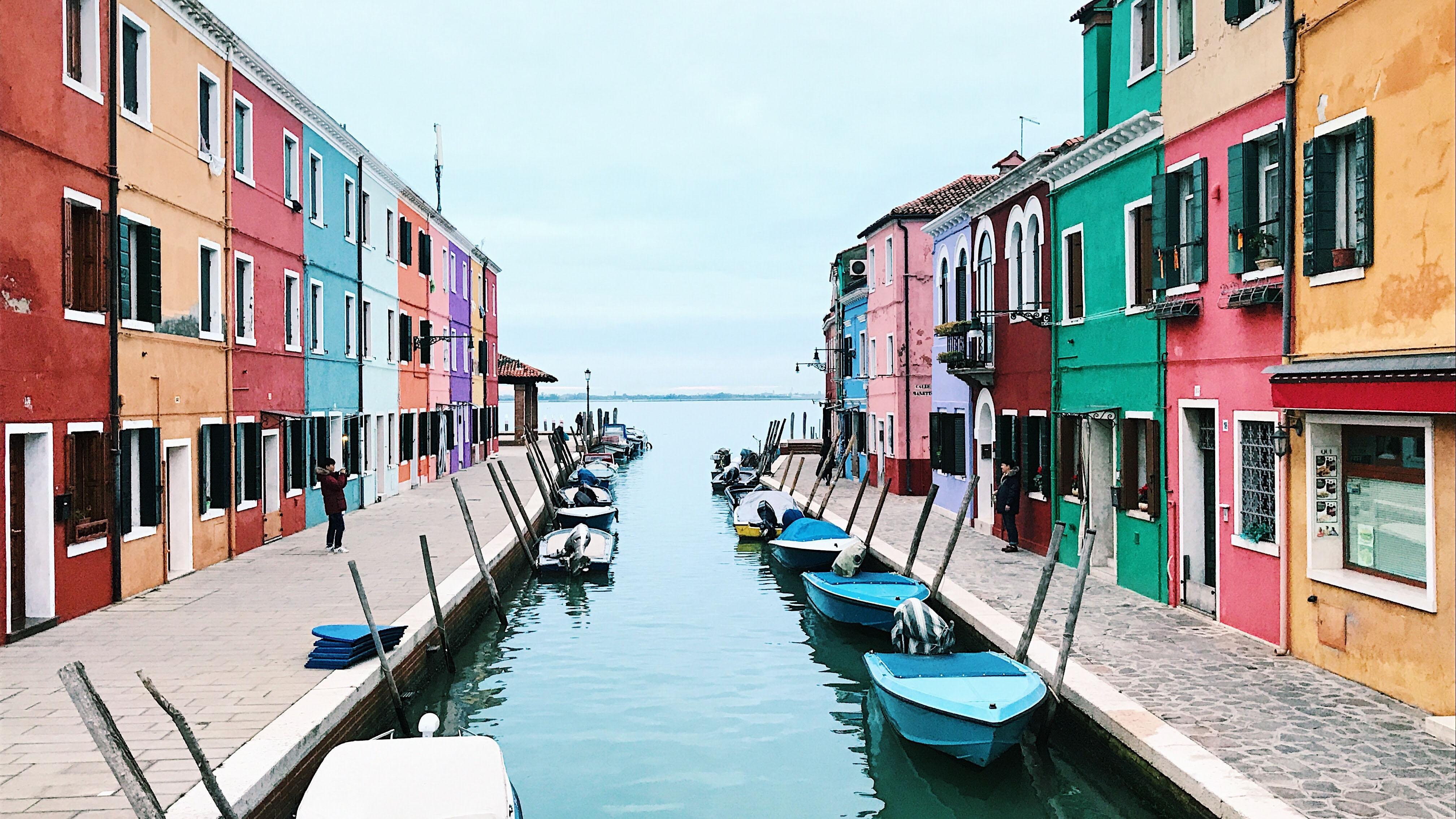 Colorful buildings line a canal