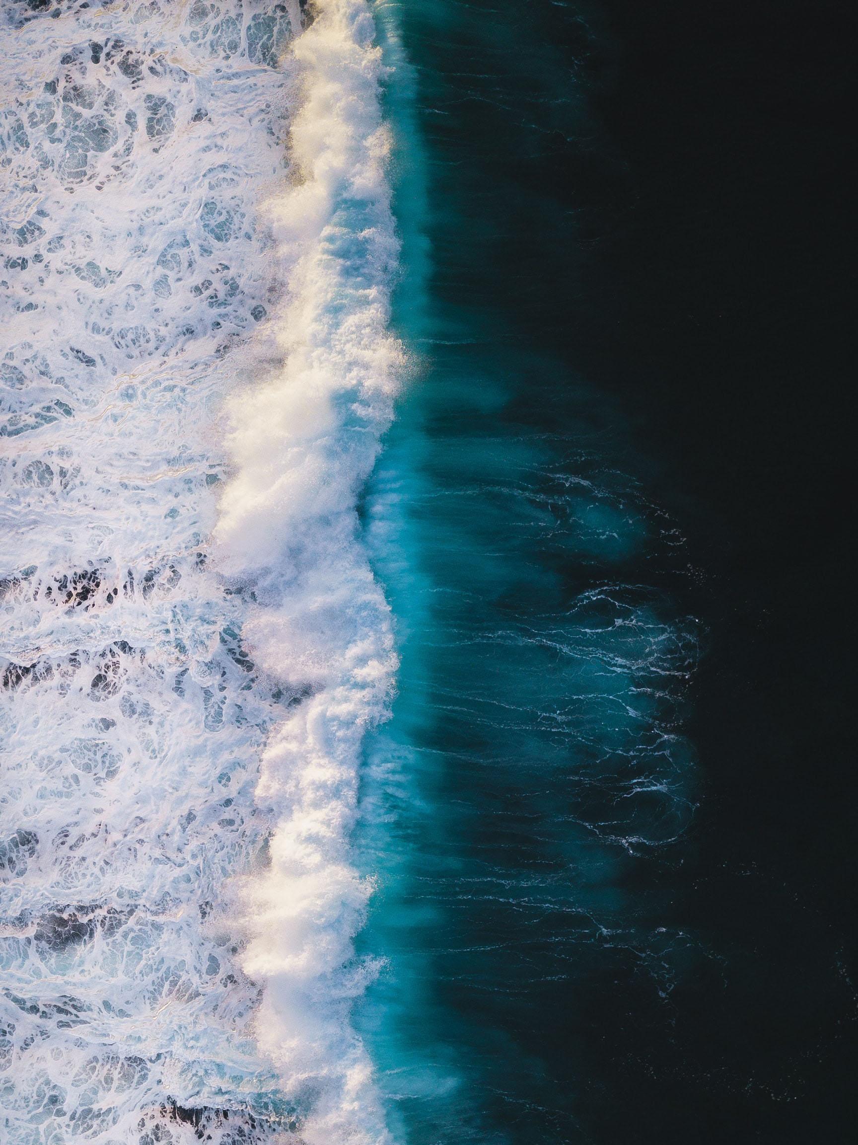 Overhead view of the line where the ocean meets the shore