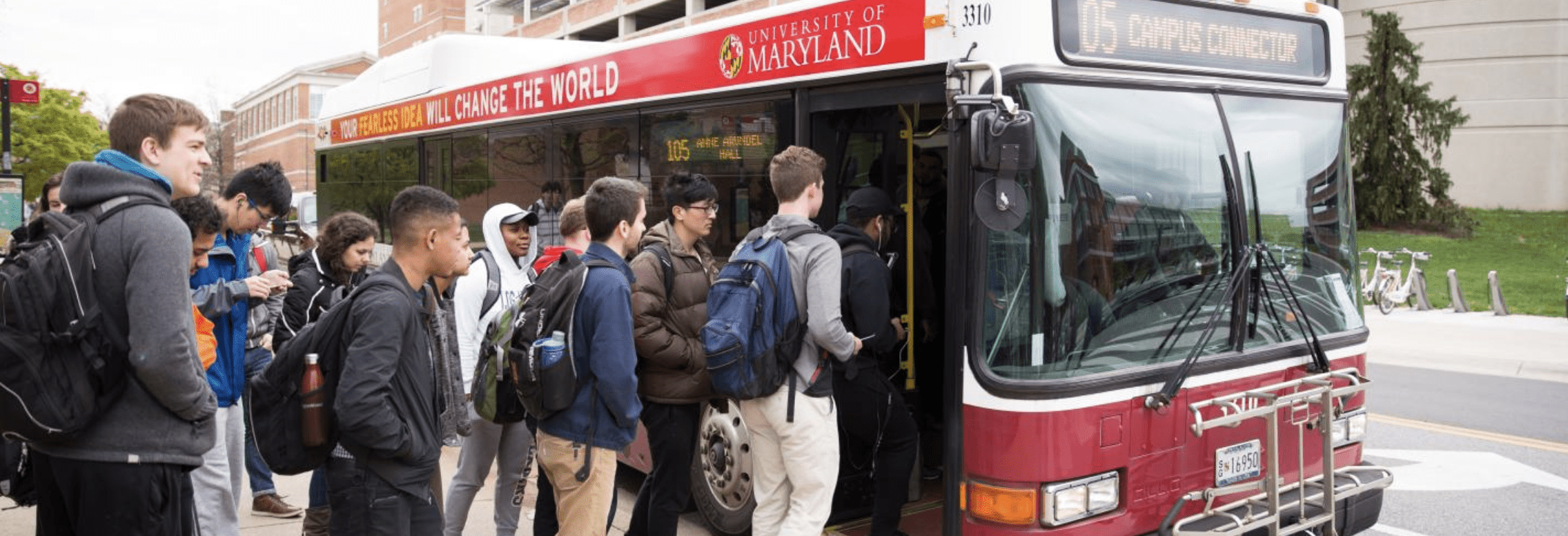 students getting on a bus
